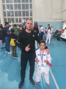 Евгений Александрович со своим юным спортсменом